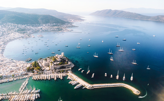 Saint Peter Castle and marina - Bodrum, Turkey. Bodrum castle with Sailing ship yachts in sea from above, aerial view. download image