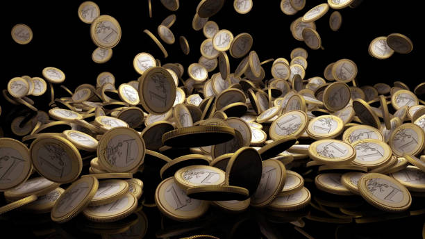 One Euro Coins Falling on The Ground stock photo