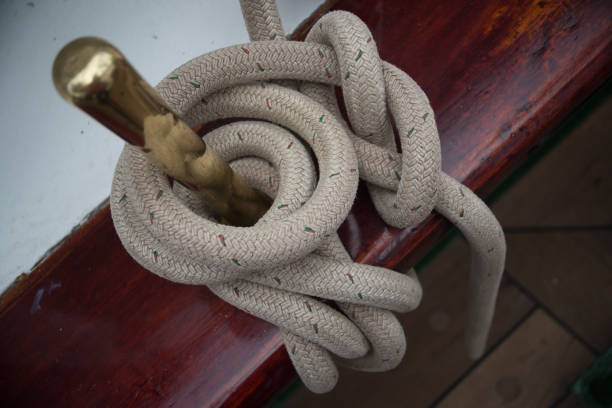 istock Ship's ropes are attached to a brass part of a sailing ship's rigging 1656845830