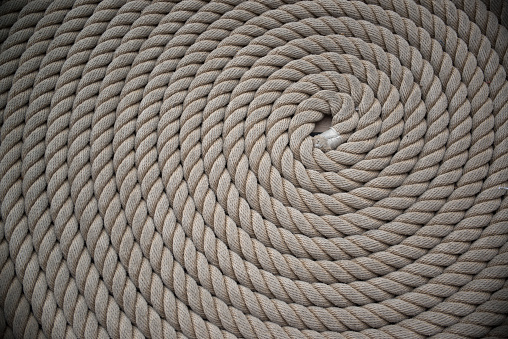 Rope detail on dark. Close-up of its rope texture Depth of field minimalism ropes.