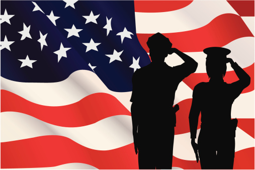 Male and female officers saluting in front of an American flag. Includes a large jpeg.