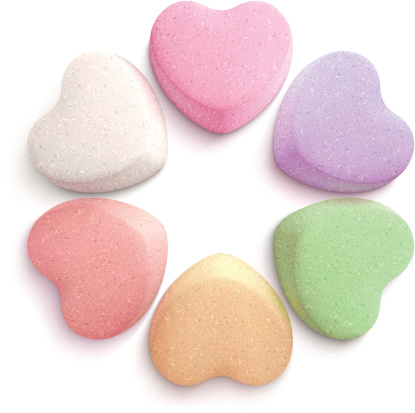 Vector illustration of six heart-shaped candies.