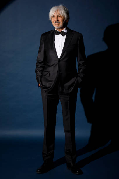 istock Active senior man. Vintage,  Retro romantic portrait.  Elegantly stylish, dressed tuxedo bow tie.   Celebration, on  stage scene. 1656869061