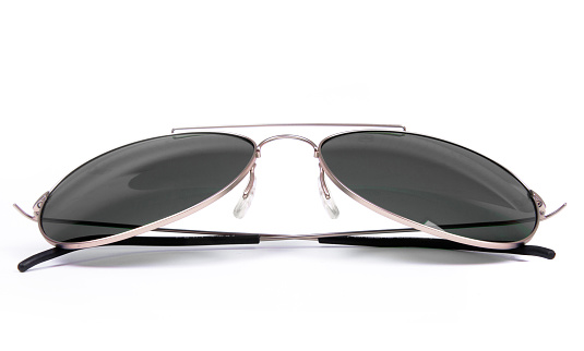 A pair of pink heart-shaped sunglasses isolated on a white background.