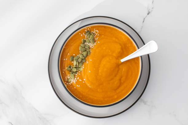 istock A bowl of pumpkin soup with mashed potatoes and seeds. Autumn menu. 1656873096