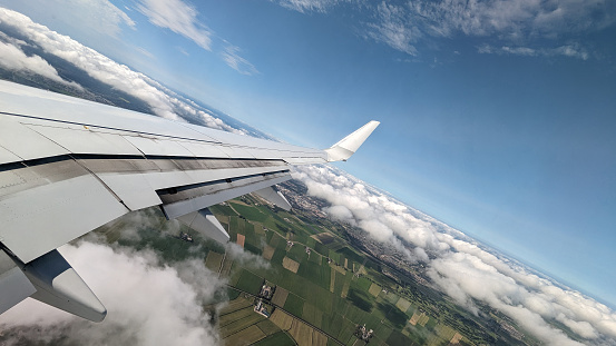 Wing of plane flying over Netherlands