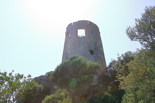 a view from the San Gemiliano tower on the rocky coast on the blue sea. Sardinia, Italy. City of Arbatax
