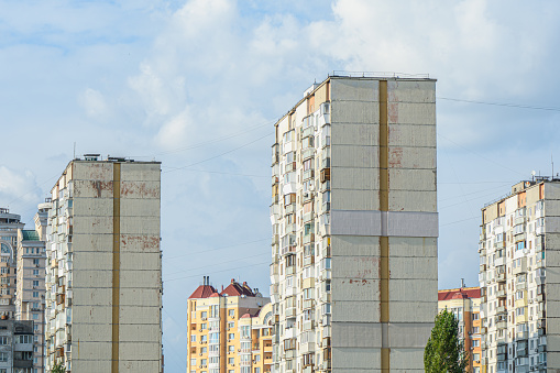 Panel multi-storey residential buildings. Against the backdrop of a clear sky, bright sunny weather.