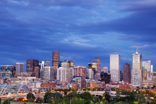 The skyscrapers in the skyline of Denver, Colorado at sunset.