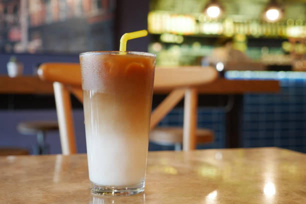 istock cold coffee in a glass container at cafe 1656932660