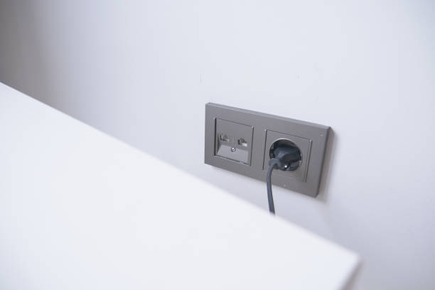 istock white color power cord cable plugged into wall 1656938232