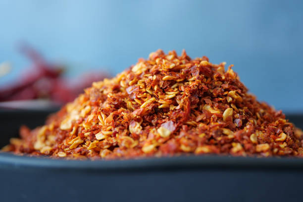 istock chili flakes in a bowl on table 1656941474