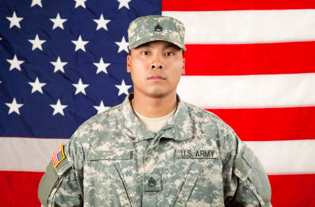 istock American Soldier against USA Flag 165694265
