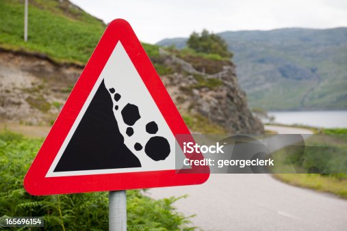 istock Falling Rocks Warning Road Sign 165696154