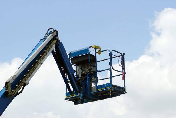 istock A blue crane loader high lift with cloudy and blue sky backgrounds 1656973314