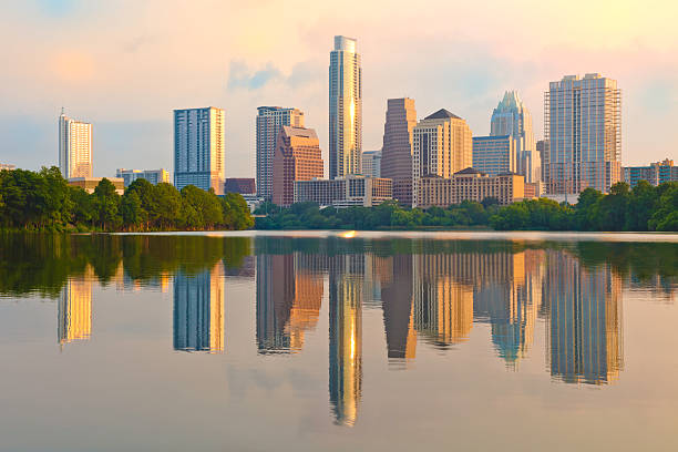 Zilker Park Sunset Austin Texas green grass landscape and perfect glowing Cityscape close up on modern skyscrapers skyline of the Modern 2018 buildings