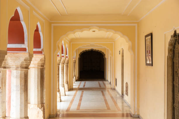 istock Lobby surrounded with marble pillar leading to the dark room 1656995433