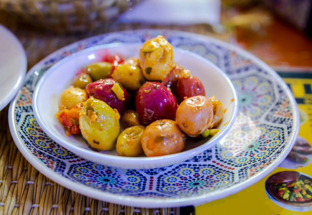 Closeup of a plate of Moroccan olive dish placed on the dining table in a restaurant in Marrakech