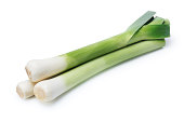 Artistic shot of three leeks on a white background