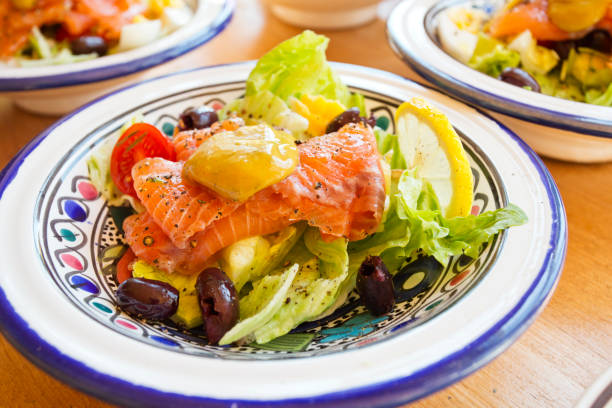Salad with raw picled salmon ready to serve Salad with raw picled salmon ready to serve gravad stock pictures, royalty-free photos & images