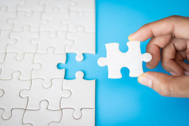 istock Human hands holding jigsaw with word problem & solution. symbol of association and connection. business strategy. 1657017552