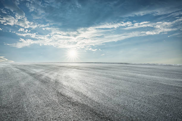 istock Empty asphalt road and clouds background at sunrise 1657057517