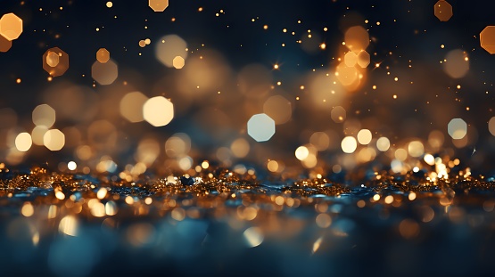 Defocused golden sequin light. Fancy gold glitter sparkle background. Studio shooting of a creative bright yellow color background. It is textured color gradient. There are no text and no people, and have copy space for design. Its Suitable for commercial use. Christmas, New Year, Diwali festive celebrations themed backgrounds, wallpapers, templates for greeting cards, banners and posters and wrapping paper is apt.
