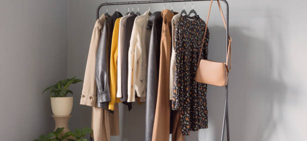 istock basic women's autumn wardrobe with shoes and handbags on  hanger 1657100902