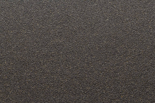 istock Close up black sandpaper texture background 1657113730