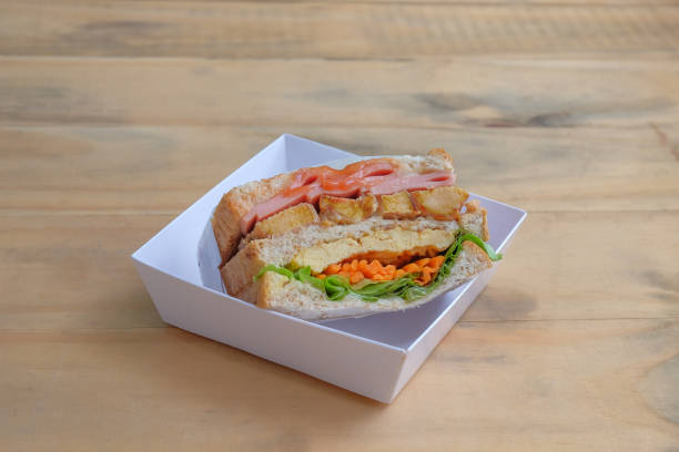 istock Sandwich with ham, cheese, tomatoes, and toasted bread. 1657140174