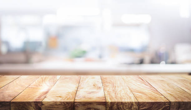 istock Selective focus.Wood table top on blur kitchen counter background.For montage product display or design key visual layout. 1657140826