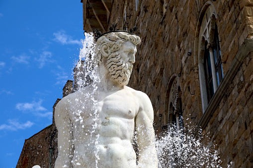 The Fountain of Neptune. Neptune's face is a part of large fountain situated on the Piazza della Signoria in Florence, Italy
