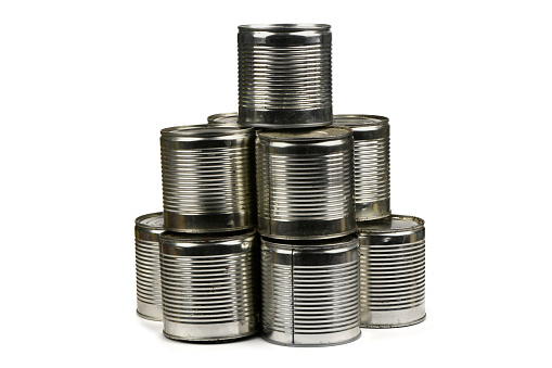 Open metal tin cans placed in pyramid isolated on white background. High resolution photo. Full depth of field.