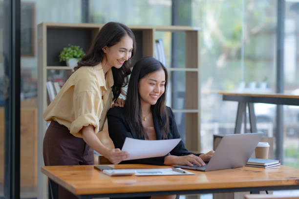 istock Asian businesswoman teamwork discussing and using laptop. 1657250308