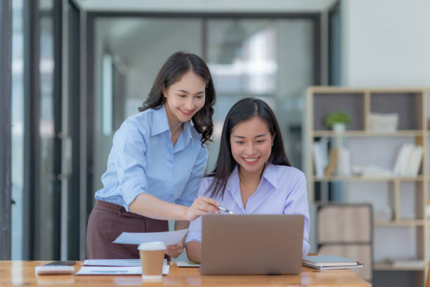 istock Asian businesswoman teamwork discussing and using laptop. 1657250320
