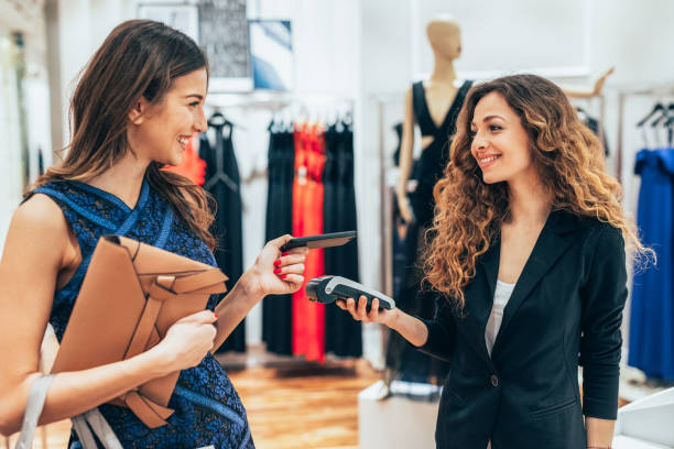 istock Paying via smart phone at a clothing store 1657268161