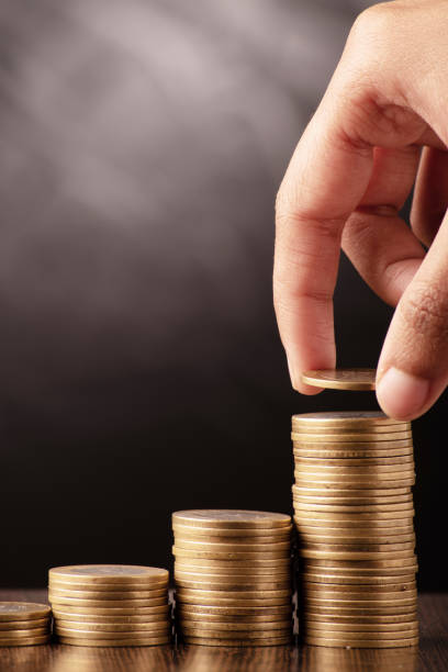 istock Money investing putting coin stack 1657280841