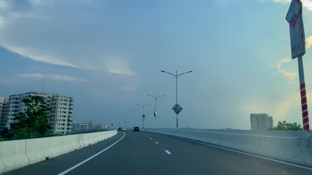 Dhaka Elevated Expressway POV Driving shot. infrastructure development in Bangladesh. Dhaka Cityscape