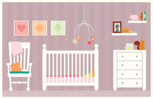 A precious little baby girls bedroom or nursery decorated in pastels with toys