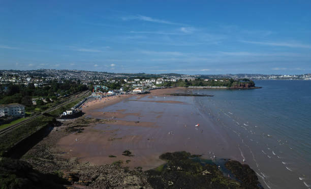 istock Goodrington Sands, Torbay, South Devon, England: DRONE VIEWS: A high angle view of Goodrington Sands South beach with sunbathers and swimmers 1657330132