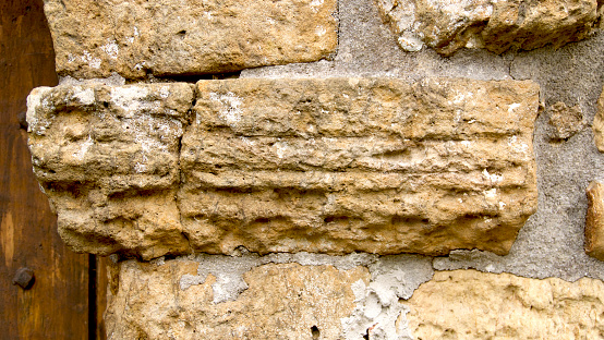 carved base of door arch