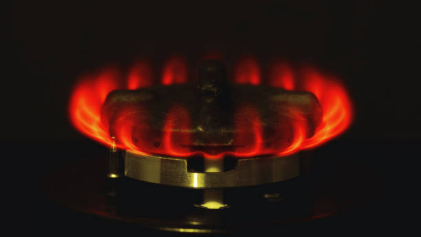 a gas stove that burst with hellfire stock photo