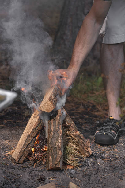 istock A tourist makes a fire in the forest 1657362198