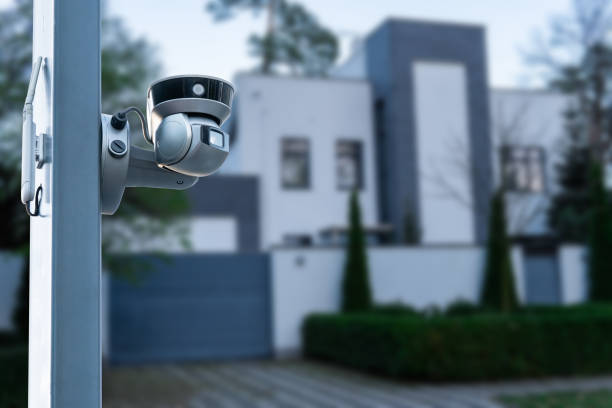 istock Security camera and private house on the background. 1657362213