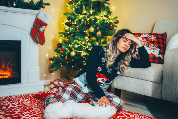 istock Depressed woman at home during Christmas 1657362330