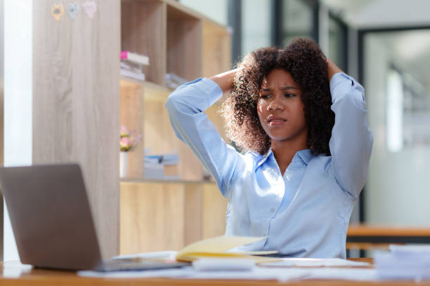 istock Young business woman worried about problem at work and stressed about problem with laptop computer. 1657382151