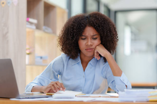 istock Young business woman worried about problem at work and stressed about problem with laptop computer. 1657382155