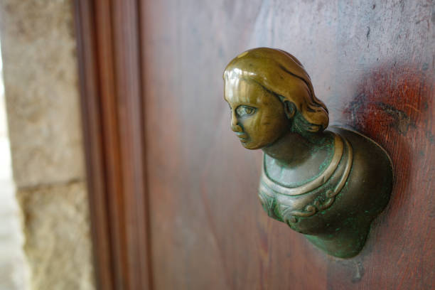 Venice, Italy - 14 Nov, 2022: Female figure door handle on a Venetian building