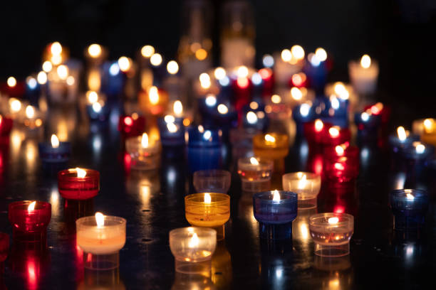 istock Colorful candles in the dark 1657414096
