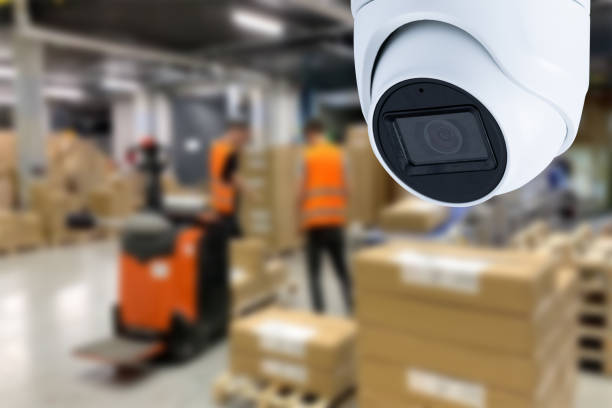 istock CCTV Camera Operating inside warehouse or factory. Copy space. 1657418463